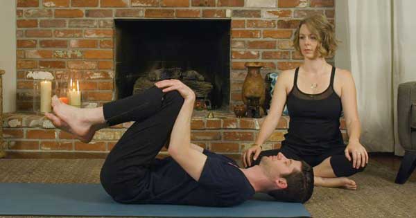Double knee to chest yoga pose