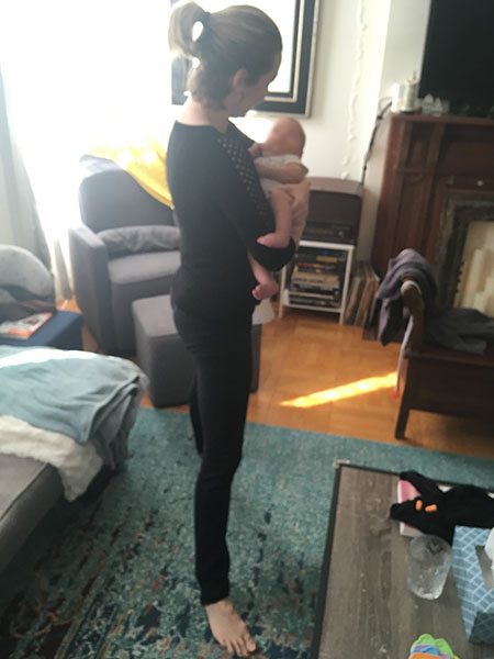 Yoga pose while holding a baby