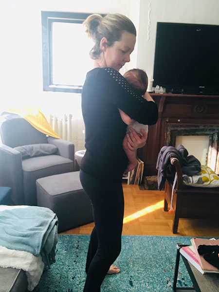 Neutral posture while standing and holding a baby