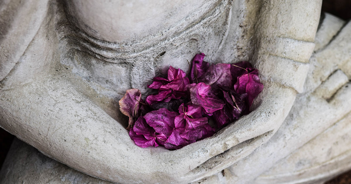 Stone statue with flowers representing kegels