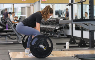 Woman poised to start a deadlift